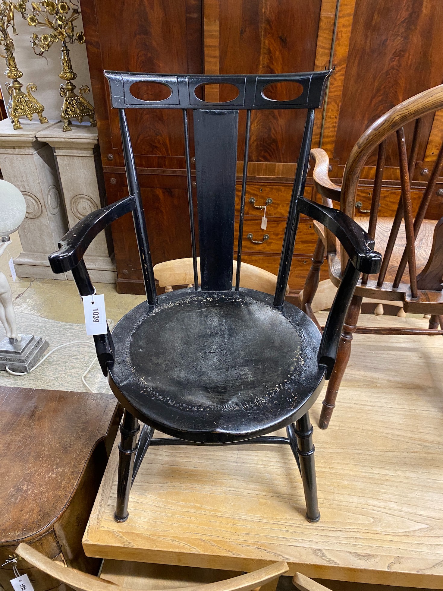 A James Shoolbred ebonised salon chair